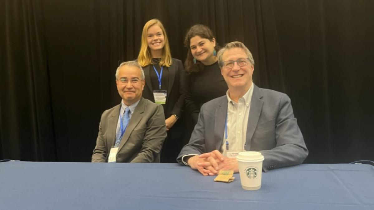 Joel Kaufman poses with three colleagues 