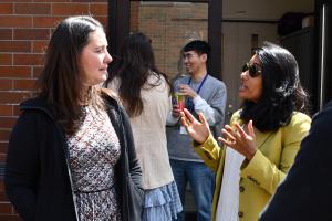 People mingle on an outdoor patio 